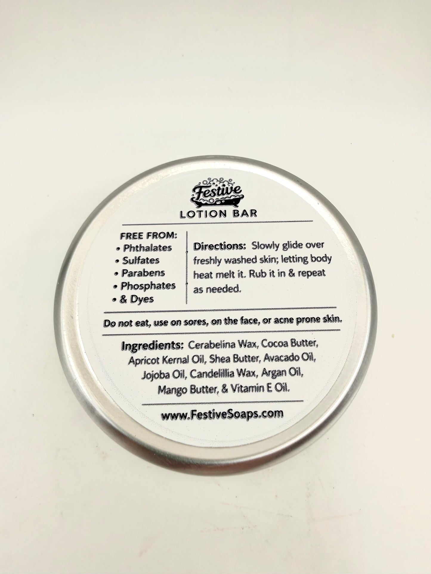 Lotion bar container with label on a white background