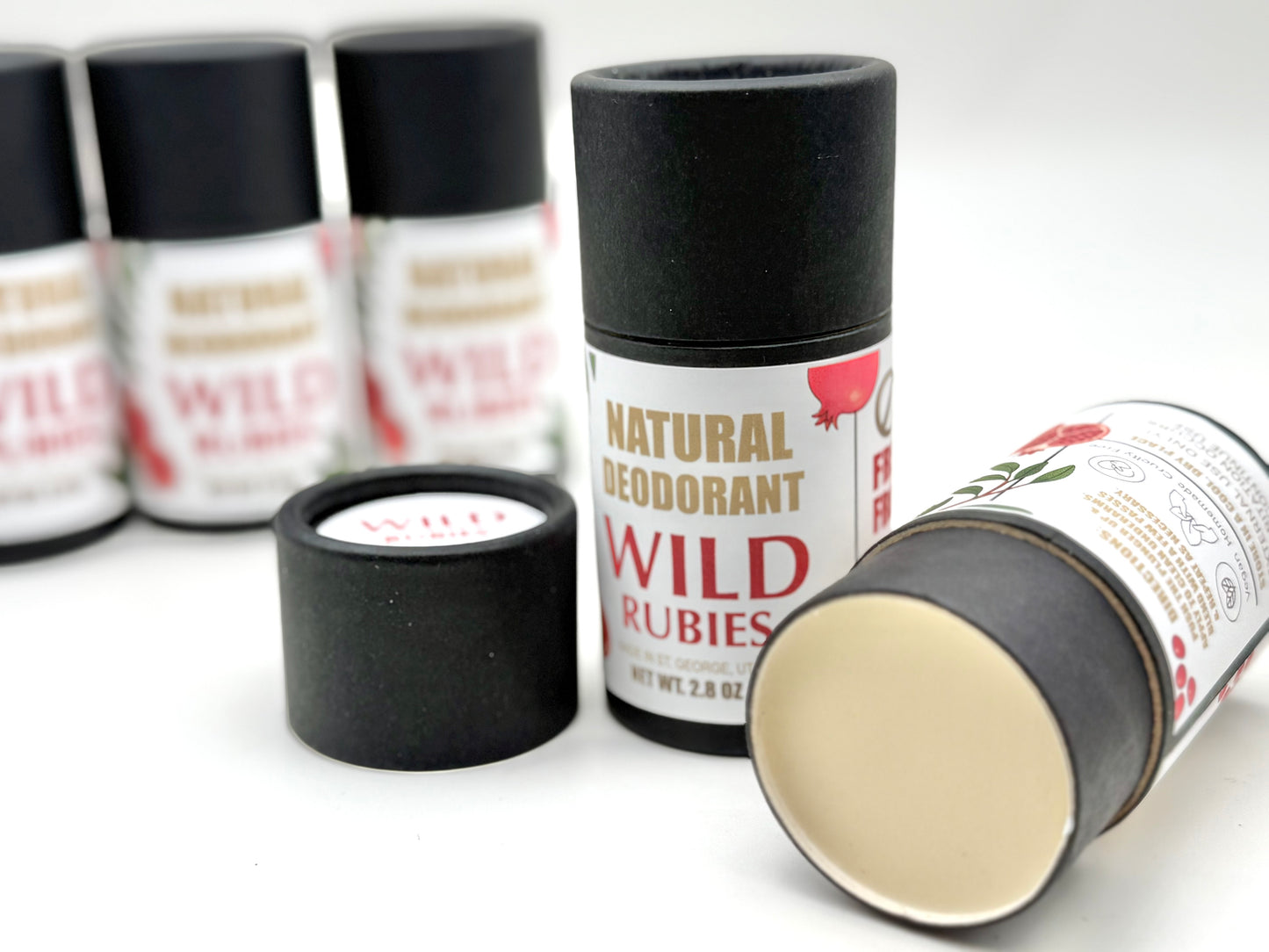 Natural deodorant containers with 'Wild Rubies' branding on a white background