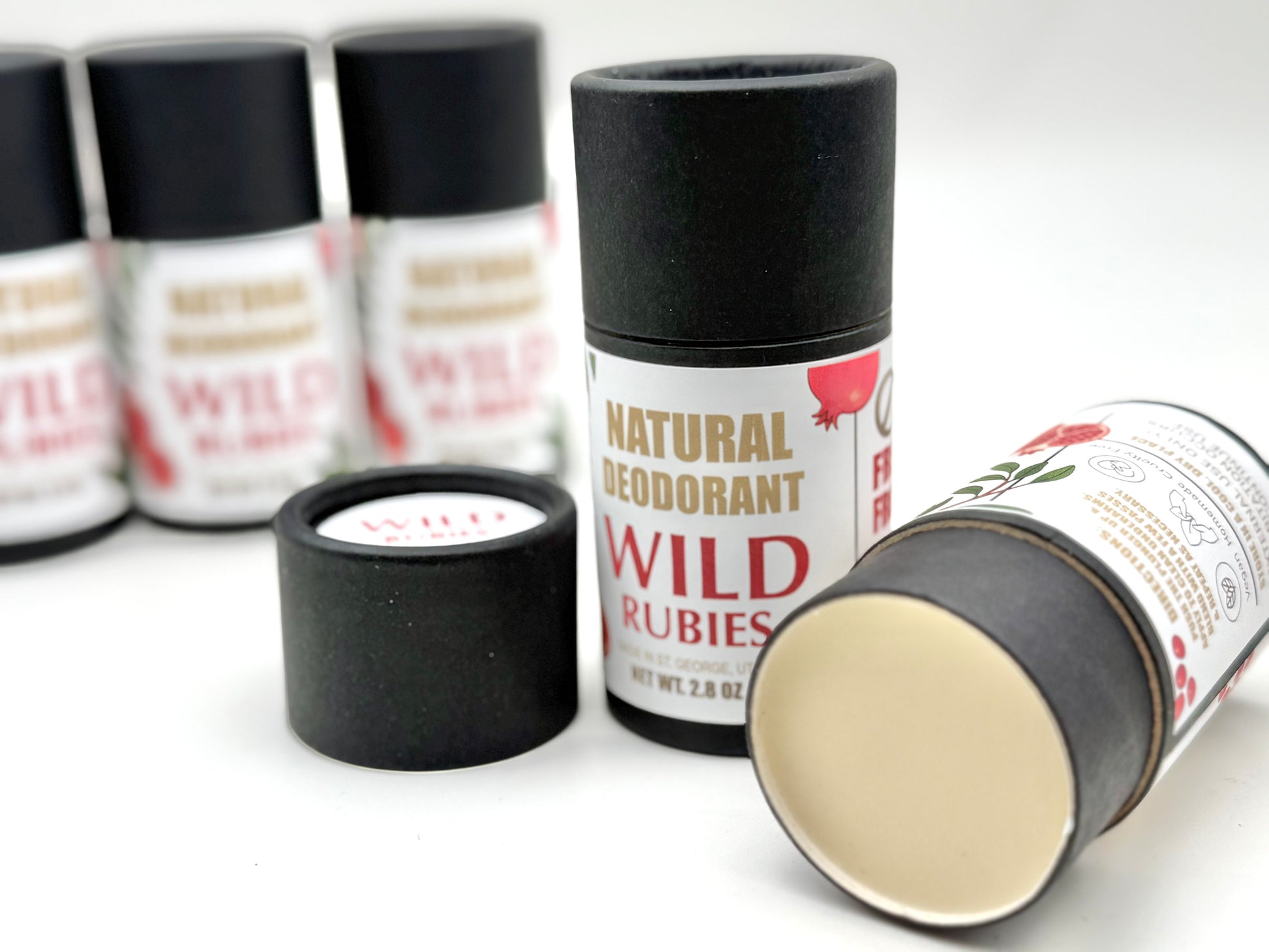 Natural deodorant containers with 'Wild Rubies' branding on a white background