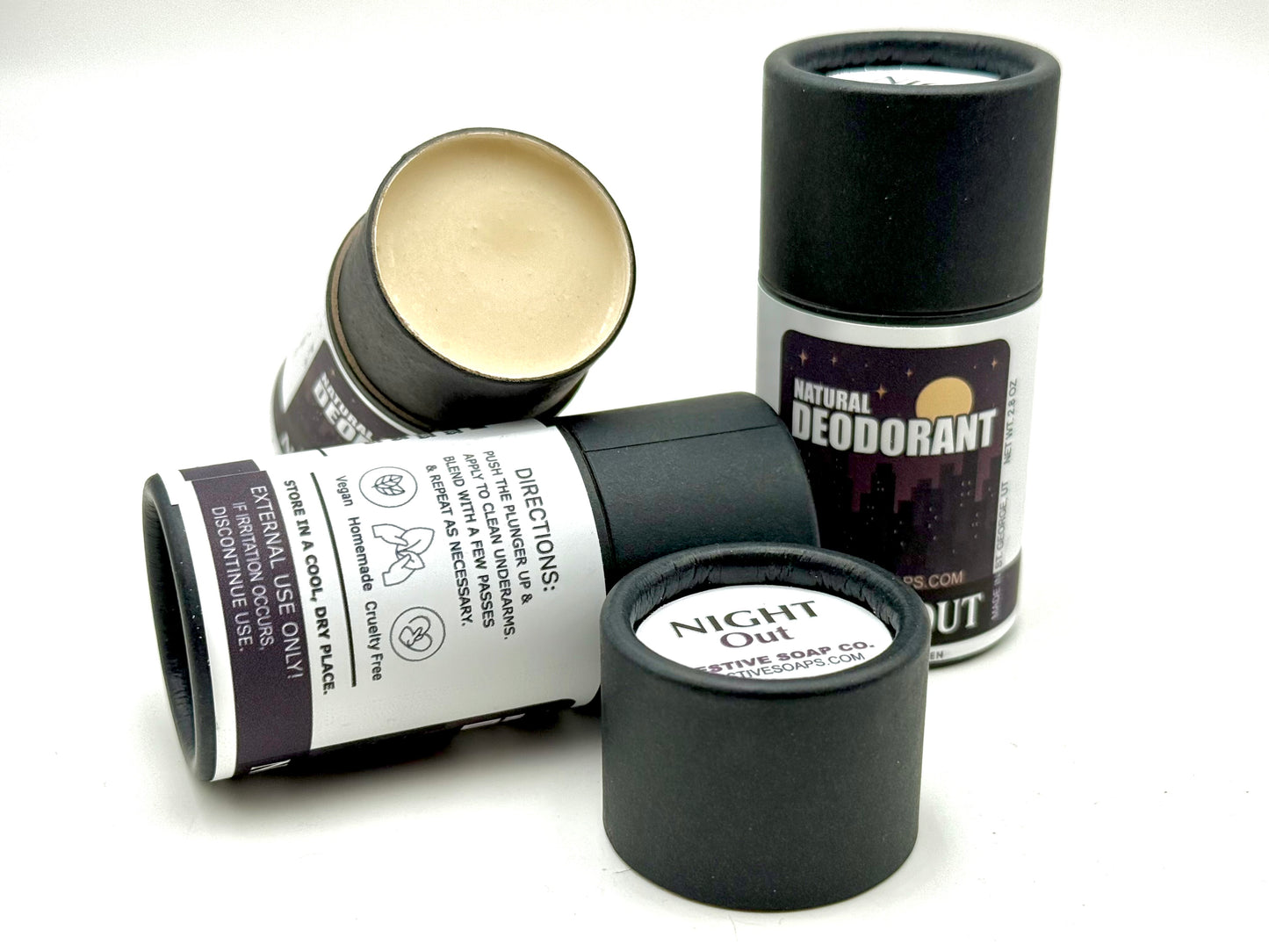 Collection of natural deodorant sticks on a white background