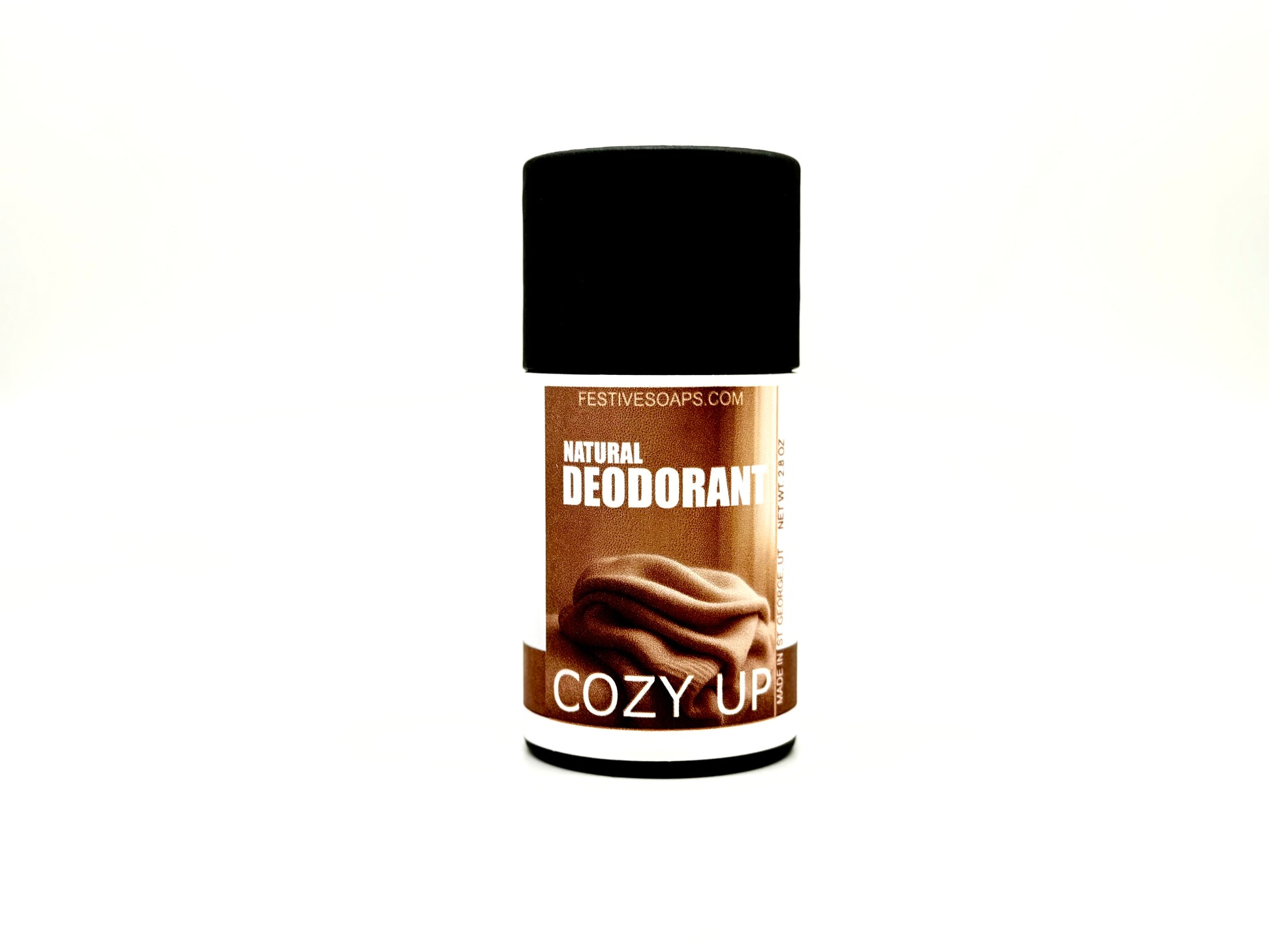Natural deodorant stick with 'Cozy Up' flavor on a white background