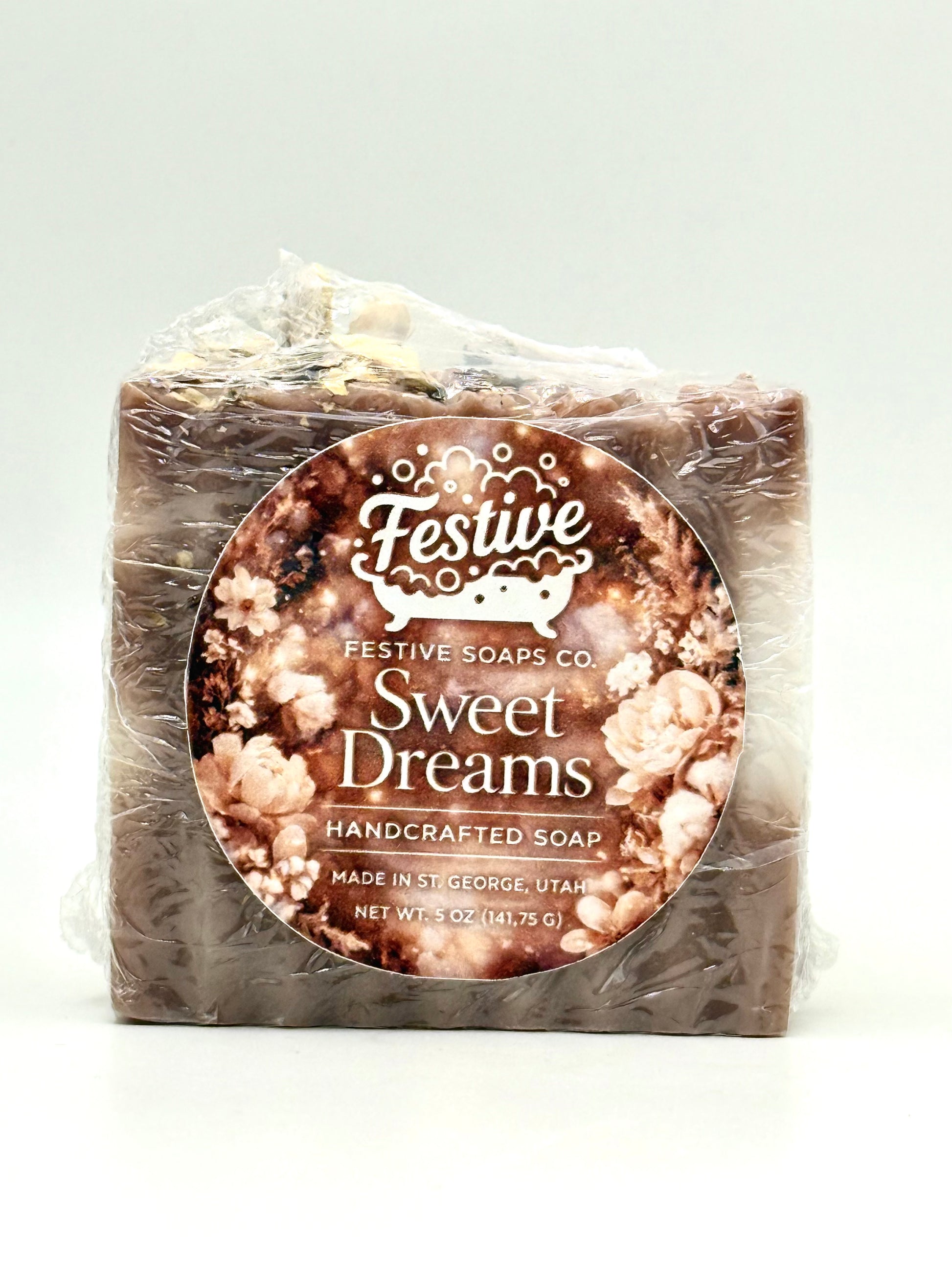 Handcrafted soap bar with 'Sweet Dreams' label on a white background