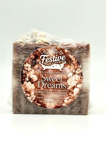 Handcrafted soap bar with 'Sweet Dreams' label on a white background