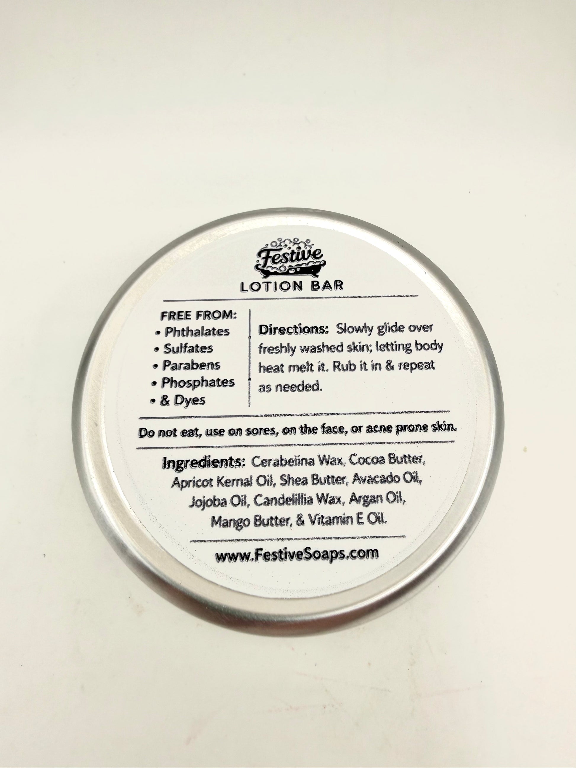 Lotion bar container with label on a white background