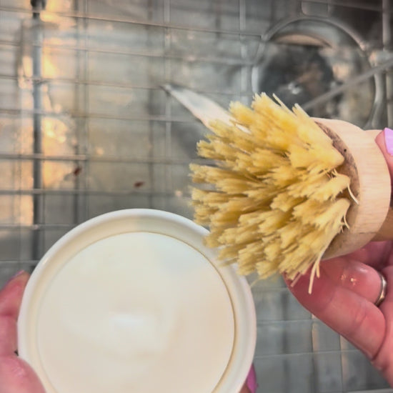 video showing some dishes being scrubbed with the dish soap set