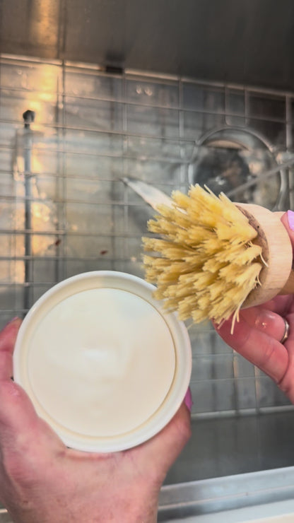 video showing some dishes being scrubbed with the dish soap set